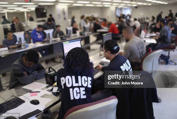 Immigration and Customs Enforcement , officers process detained undocumented immigrants on April 11, 2018 at the U.S. Federal Building in lower...