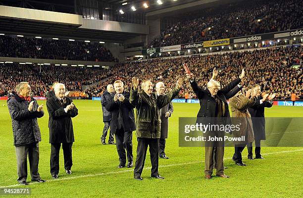 Liverpool legendary players walk onto the pitch as bag-pipes play at Anfield in commemoration of Bill Shankly's 50th anniversary of being involved at...