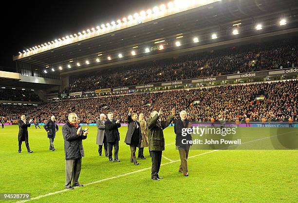 Liverpool legendary players walk onto the pitch as bag-pipes play at Anfield in commemoration of Bill Shankly's 50th anniversary of being involved at...