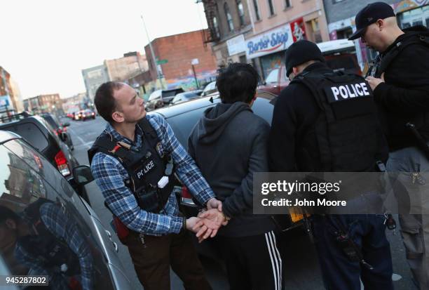 Immigration and Customs Enforcement , officers arrest an undocumented Mexican immigrant during a raid in the Bushwick neighborhood of Brooklyn on...