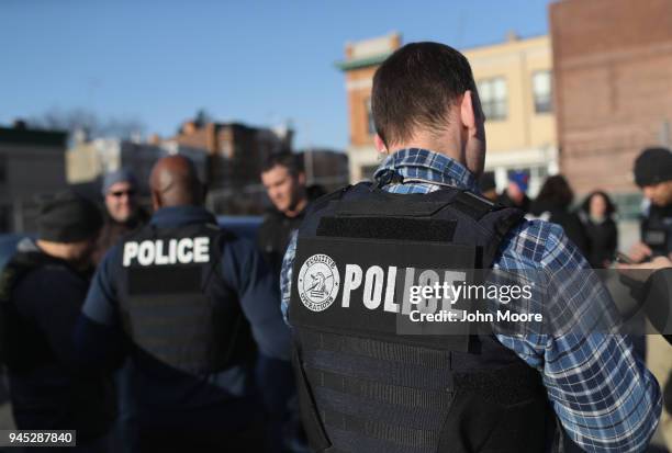 Immigration and Customs Enforcement , officers gather for a debriefing after operations to arrest undocumented immigrants on April 11, 2018 in the...