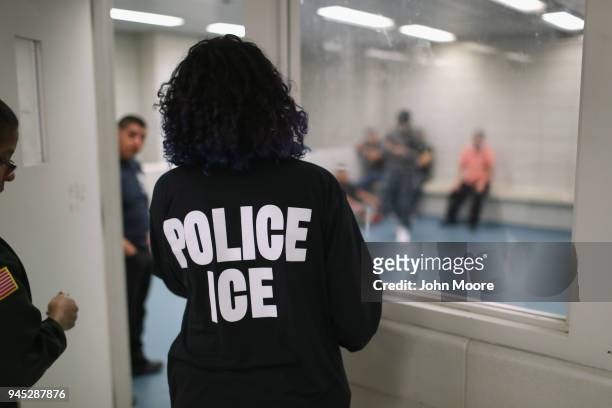 Undocumented immigrants wait in a holding cell at a U.S. Immigration and Customs Enforcement , processing center on April 11, 2018 at the U.S....