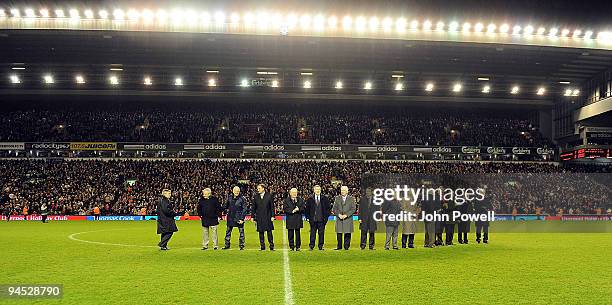 Liverpool legendary players walk onto the pitch as bag-pipes play at Anfield in commemoration of Bill Shankly's 50th anniversary of being involved at...