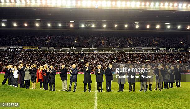 Liverpool legendary players walk onto the pitch as bag-pipes play at Anfield in commemoration of Bill Shankly's 50th anniversary of being involved at...