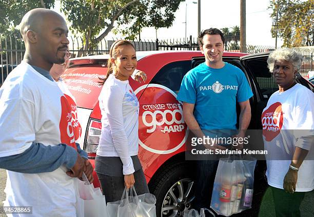 Carrie Ann Inaba, Matthew Rhys and Volunteers attend AARP's Create the Good and EIF's iParticipate to Volunteer at the Los Angeles Regional Food Bank.