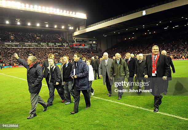 Liverpool legendary players walk onto the pitch as bag-pipes play at Anfield in commemoration of Bill Shankly's 50th anniversary of being involved at...