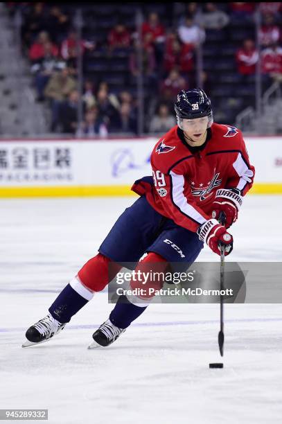 Alex Chiasson of the Washington Capitals skates with the puck in the first period against the Los Angeles Kings at Capital One Arena on November 30,...