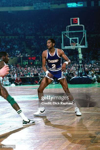 Alex English of the Denver Nuggets stands on the court against the Boston Celtics during a game played in 1982 at the Boston Garden in Boston,...