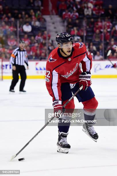 Madison Bowey of the Washington Capitals skates with the puck in the first period against the Los Angeles Kings at Capital One Arena on November 30,...