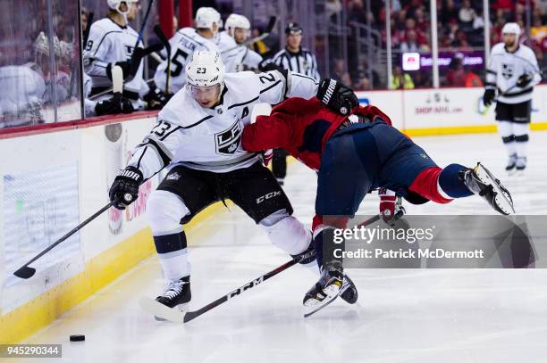 Dustin Brown of the Los Angeles Kings and Dmitry Orlov of the Washington Capitals battle for the puck in the second period at Capital One Arena on...