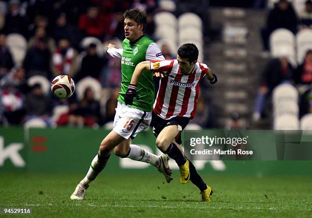 Markel Susaeta of Bilbao and Sebastian Proedl of Bremen compete for the ball during the UEFA Europa League Group L match between Atletico Bilbao and...