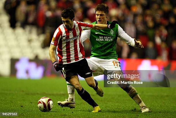 Markel Susaeta of Bilbao and Sebastian Proedl of Bremen compete for the ball during the UEFA Europa League Group L match between Atletico Bilbao and...