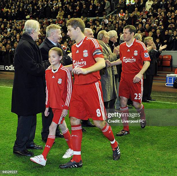 Liverpool FC players walk through the legendary Shankly team during the Barclays Premier League match between Liverpool and Wigan Athletic at Anfield...