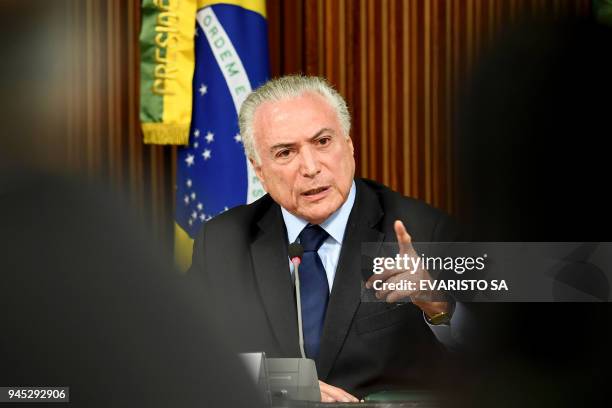 Brazilian President Michel Temer delivers a speech during a ministerial cabinet meeting at Planalto Palace in Brasilia on April 12, 2018. Temer...