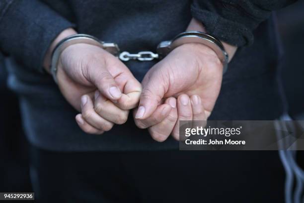 An immigrant is detained by U.S. Immigration and Customs Enforcement , officers during an operation on April 11, 2018 in New York City. ICE...