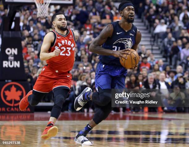 Terrence Ross of the Orlando Magic dribbles the ball as Fred VanVleet of the Toronto Raptors defends during the first half of an NBA game at Air...