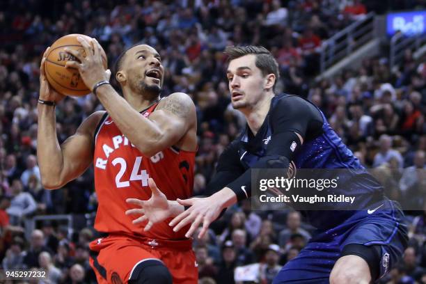 Norman Powell of the Toronto Raptors shoots the ball as Mario Hezonja of the Orlando Magic defends during the second half of an NBA game at Air...