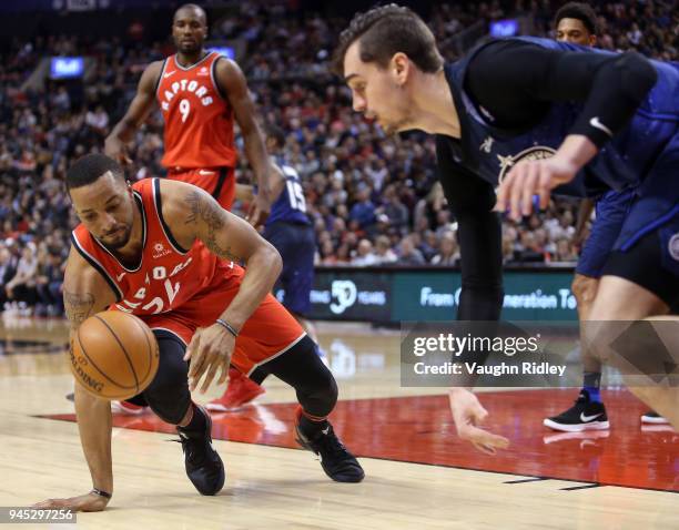 Norman Powell of the Toronto Raptors dribbles the ball as Mario Hezonja of the Orlando Magic defends during the second half of an NBA game at Air...