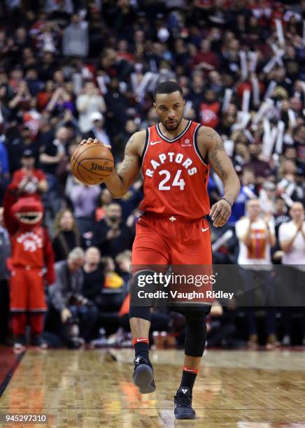 Norman Powell of the Toronto Raptors dribbles the ball during the second half of an NBA game against the Orlando Magic at Air Canada Centre on April...