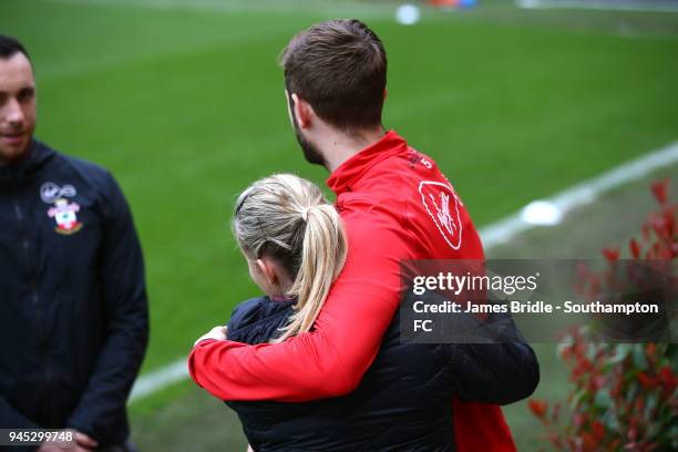 Jack Stephens hugs training staff ahead of a Southampton FC training session at Staplewood Complex on April 12, 2018 in Southampton, England.