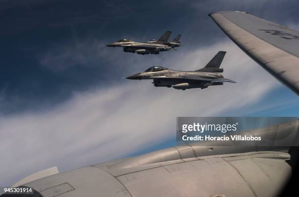 Dutch Air Force F-16 fighters fly near a Dutch Air Force KDC10 tanker after having been refueled over the North Sea during press day of European Air...