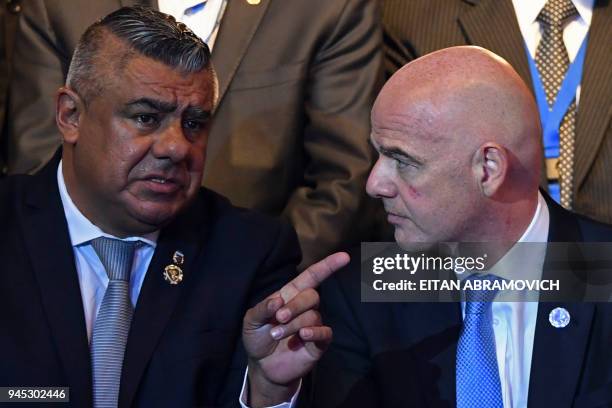 Argentinian Football Association President Claudio Tapia speaks with FIFA President Gianni Infantino, during the 68th Conmebol Council meeting in...