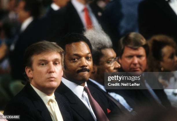 Heavyweight Title: View of businessman Donald Trump, Reverend Jesse Jackson, promoter Don King, and University of Miami football coach Jimmy Johnson...