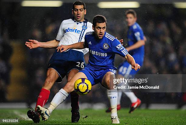 Joe Cole of Chelseabattles with Tal Ben Haim of Portsmouth during the Barclays Premier League match between Chelsea and Portsmouth at Stamford Bridge...