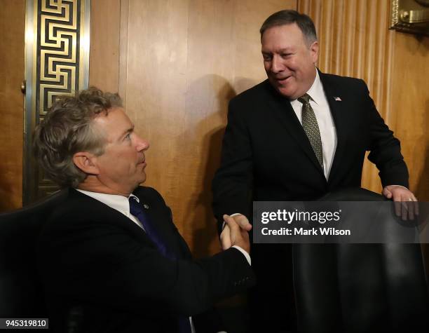 Secretary of State nominee Mike Pompeo , greets Sen. Rand Paul , during his confirmation hearing before a Senate Foreign Relations Committee on...