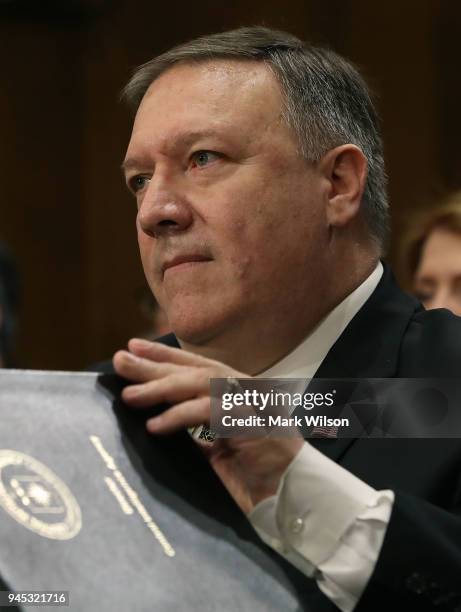 Secretary of State nominee Mike Pompeo listens to questions during his confirmation hearing before a Senate Foreign Relations Committee on Capitol...