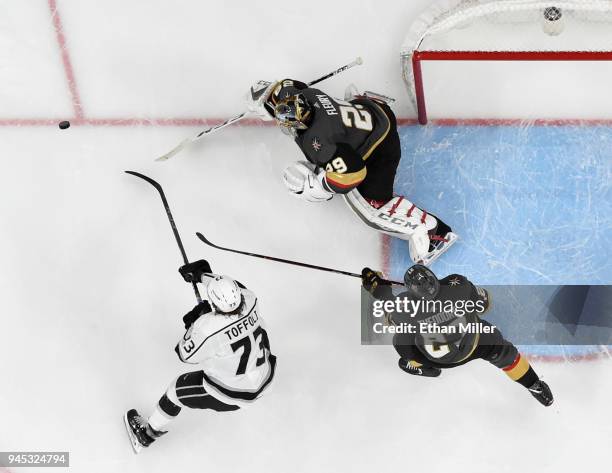 Marc-Andre Fleury of the Vegas Golden Knights blocks a shot by Tyler Toffoli of the Los Angeles Kings as Shea Theodore of the Golden Knights defends...