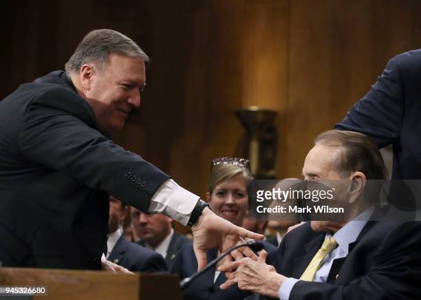 Secretary of State nominee Mike Pompeo , thanks former Senate Majority Leader Bob Dole , for his comments during his confirmation hearing before a...