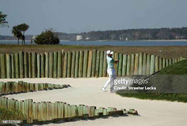 Wesley Bryan plays a shot from a greenside bunker on the 17th hole during the first round of the 2018 RBC Heritage at Harbour Town Golf Links on...