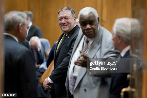 Michael Pompeo, director of the Central Intelligence Agency and U.S. Secretary of state nominee for President Donald Trump, center, arrives to a...