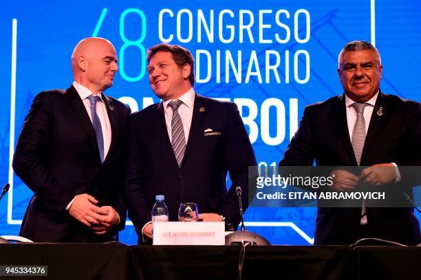Conmebol president Alejandro Dominguez , FIFA president Gianni Infantino and Argentinian Argentine Football Association President Claudio Tapia pose...