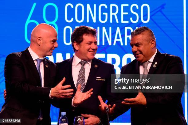 Conmebol president Alejandro Dominguez , FIFA president Gianni Infantino and Argentinian Argentine Football Association President Claudio Tapia pose...