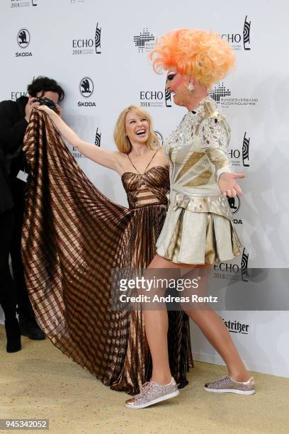 Kylie Minogue and German drag queen Olivia Jones dance together as they arrive for the Echo Award at Messe Berlin on April 12, 2018 in Berlin,...