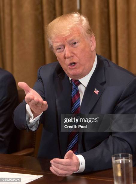 President Donald Trump participates in a meeting on trade with governors and members of Congress at the White House on April 12, 2018 in Washington,...