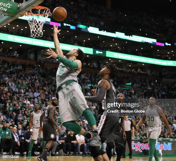 Boston Celtics' Shane Larkin makes a layup over Brooklyn Nets' D'Angelo Russell during the third quarter. The Boston Celtics host the Brooklyn Nets...