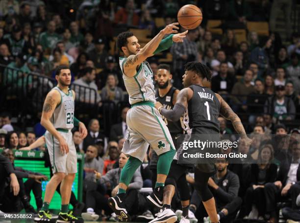 Boston Celtics' Shane Larkin passes against Brooklyn Nets' D'Angelo Russell during the first quarter. The Boston Celtics host the Brooklyn Nets in a...