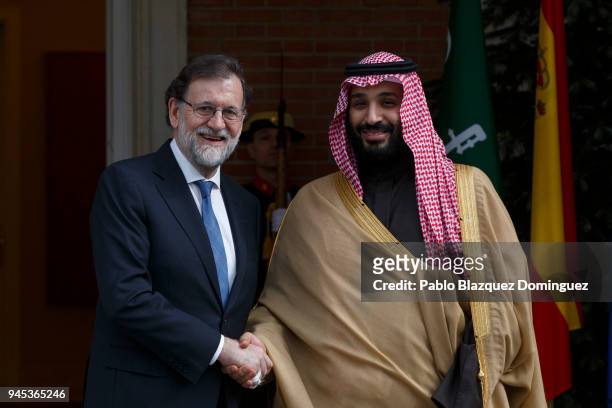 Spanish President Mariano Rajoy poses for the press as he receives Saudi Arabia Crown Prince Mohammed bin Salman at Moncloa Palace on April 12, 2018...