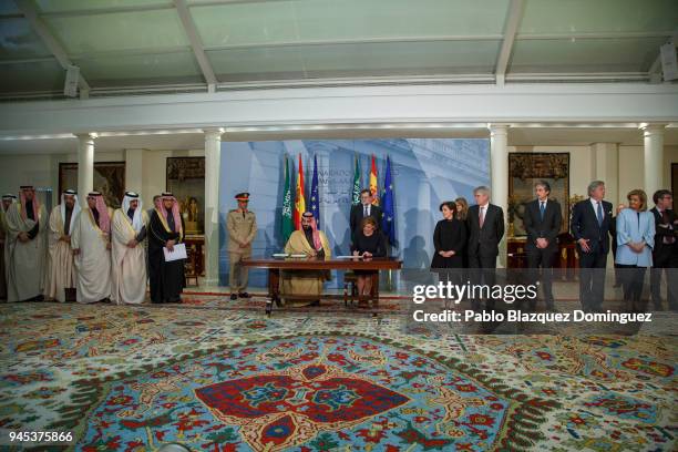 Saudi Arabia Crown Prince Mohammed bin Salman and Spanish Defence Minister Maria Dolores de Cospedal sign documents as Spanish President Mariano...