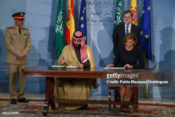 Saudi Arabia Crown Prince Mohammed bin Salman and Spanish Defence Minister Maria Dolores de Cospedal sign documents as Spanish President Mariano...
