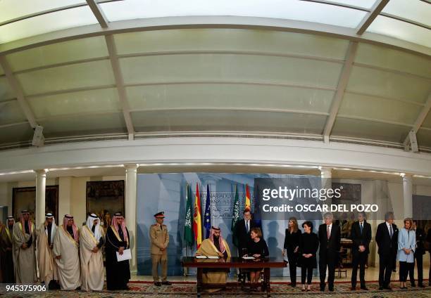 Saudi Arabia's crown prince Mohammed bin Salman and Spanish Minister of Defence Maria Doroles de Cospedal sign agreement at La Moncloa palace in...