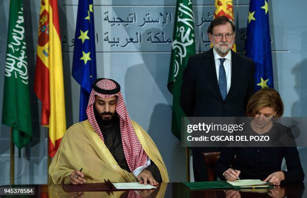 Saudi Arabia's crown prince Mohammed bin Salman and Spanish Minister of Defence Maria Doroles de Cospedal sign agreements as Spanish Pime Minister...