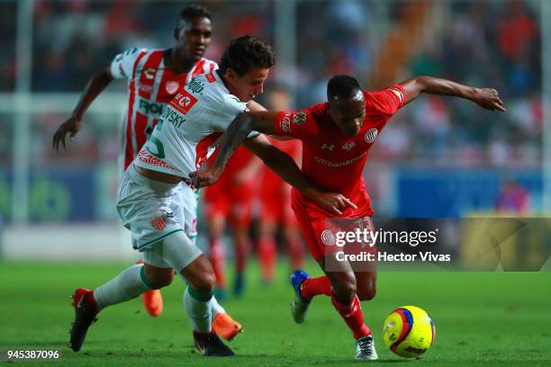 Igor Lichnovsky of Necaxa struggles for the ball with Luis Quinones of Toluca during the Championship match between Necaxa and Toluca, as part of the...