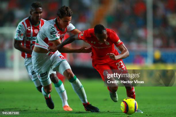 Igor Lichnovsky of Necaxa struggles for the ball with Luis Quinones of Toluca during the Championship match between Necaxa and Toluca, as part of the...