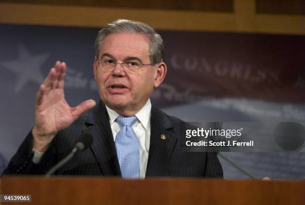 Sen. Robert Menendez, D-N.J., during a news conference on a procedural move by Republicans to slow the health bill in the Senate. Sen. Tom Coburn,...