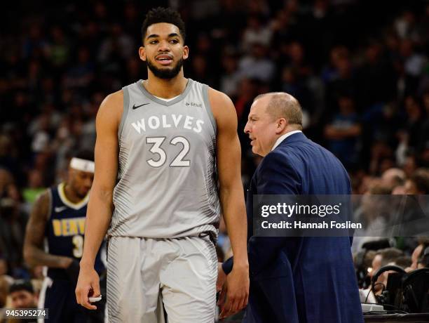 Jimmy Butler of the Minnesota Timberwolves heads to the bench as head coach Tom Thibodeau looks on during the second quarter of the game against the...