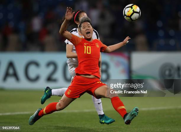 Li Ying of China and Yasmeen Khair of Jordan battle for the ball during the AFC Women's Asian Cup Group A match between Jordan and China at the Amman...